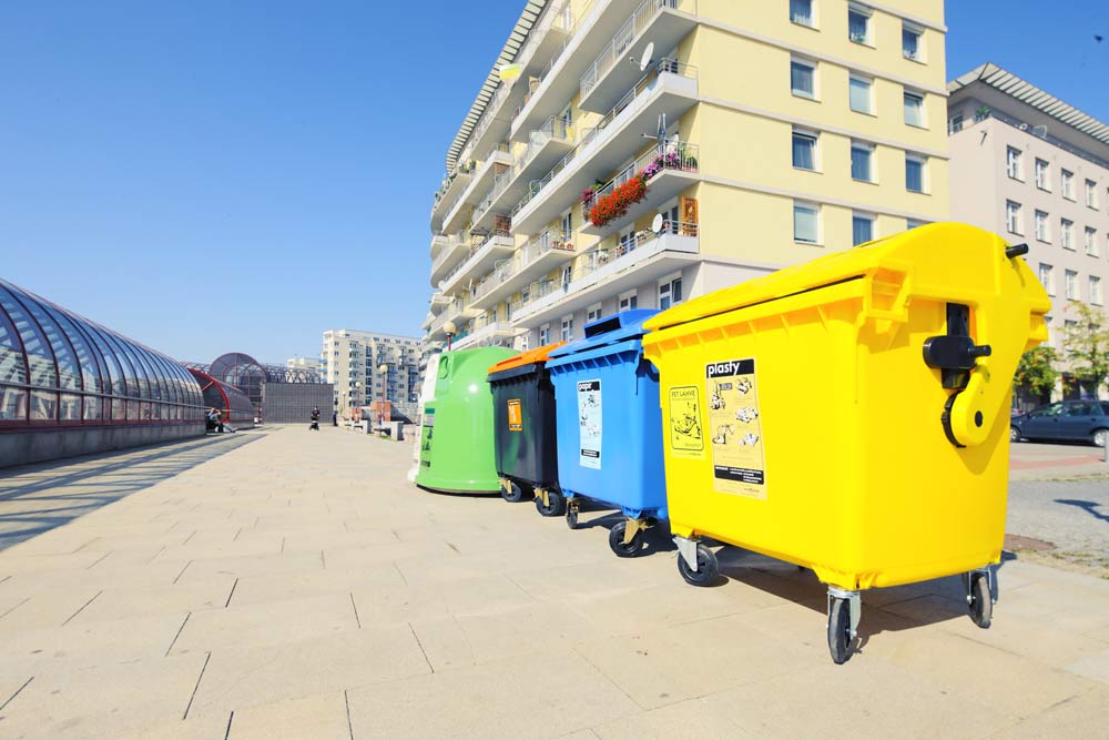 recycling collection bins outside a residential block