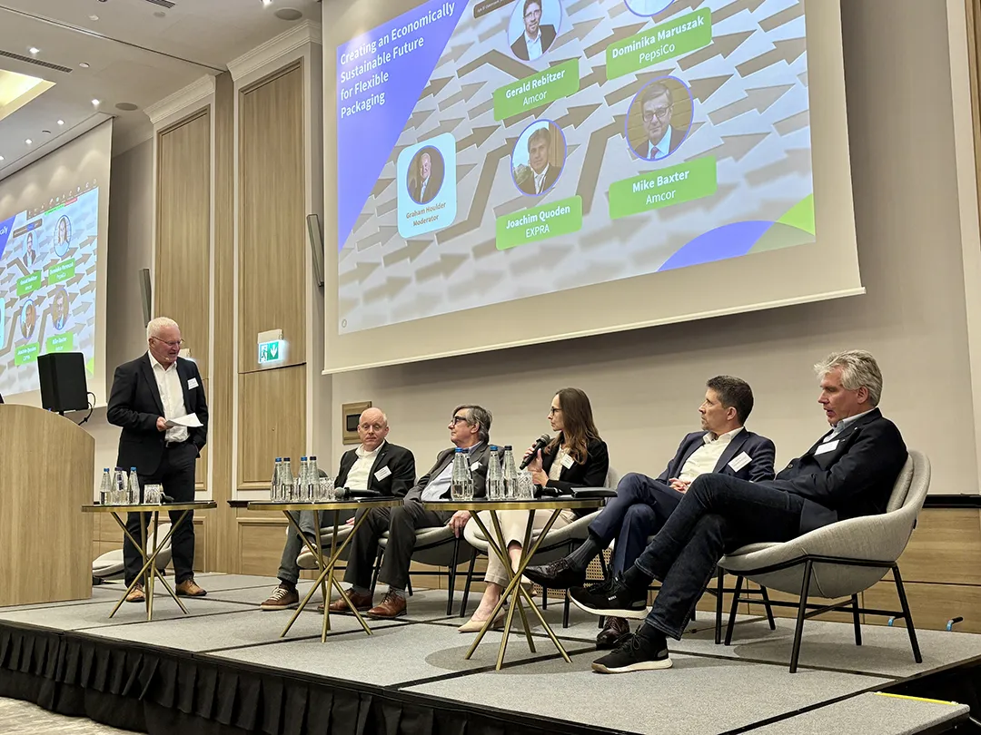 participants on stage at the Warsaw meeting