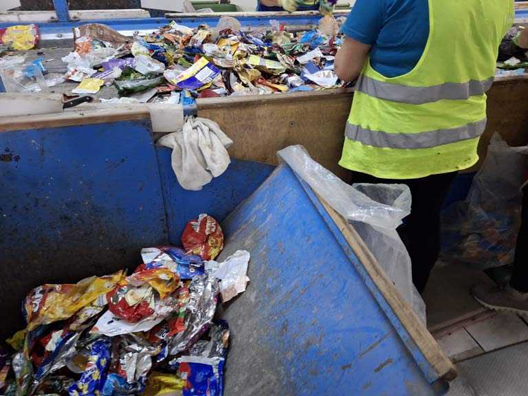 Flexibles being manually sorted in Romania